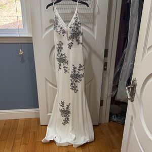 Chic White Gown with Floral Accents
